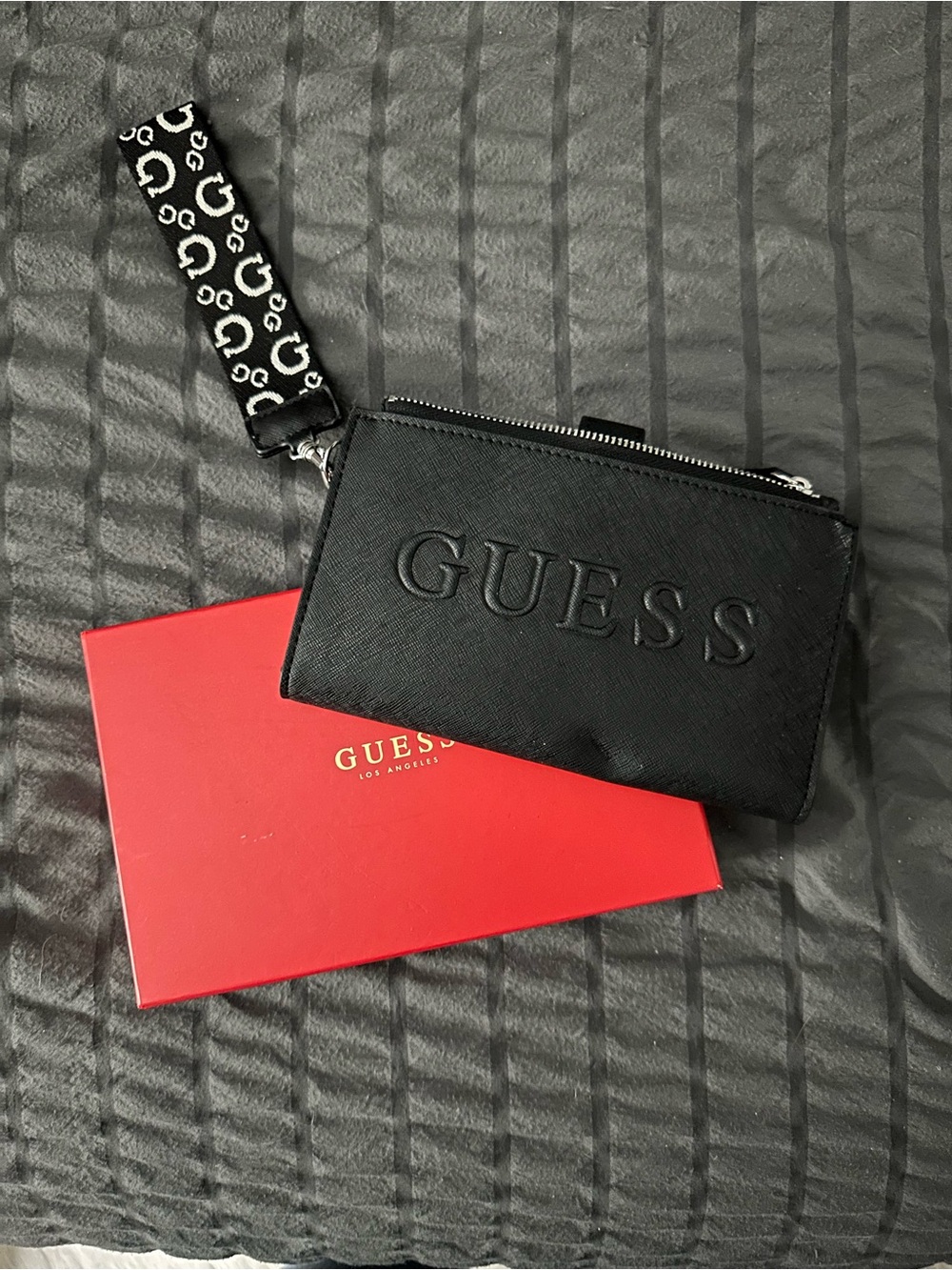 GUESS Black Embossed Wristlet with Logo Strap